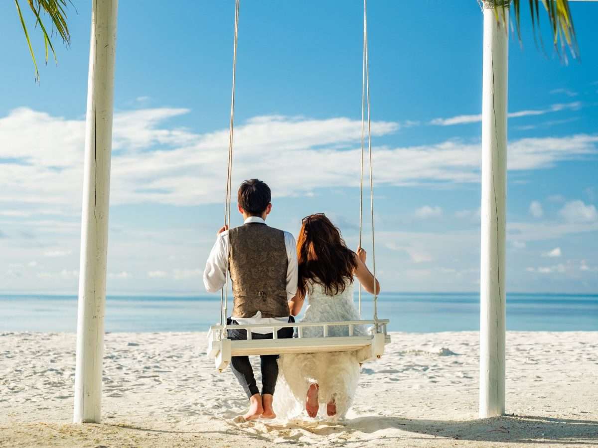 Couple Sitting On Hammock Under Coconut Tree During Daytime 1c56f136a00477bd36fd25067b0a6ea8 2000 ScaledBest Outdoor Summer Wedding Ideas