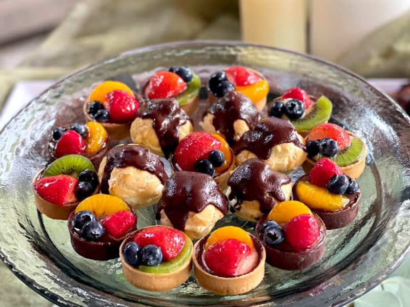 A glass plate with fruit on it.