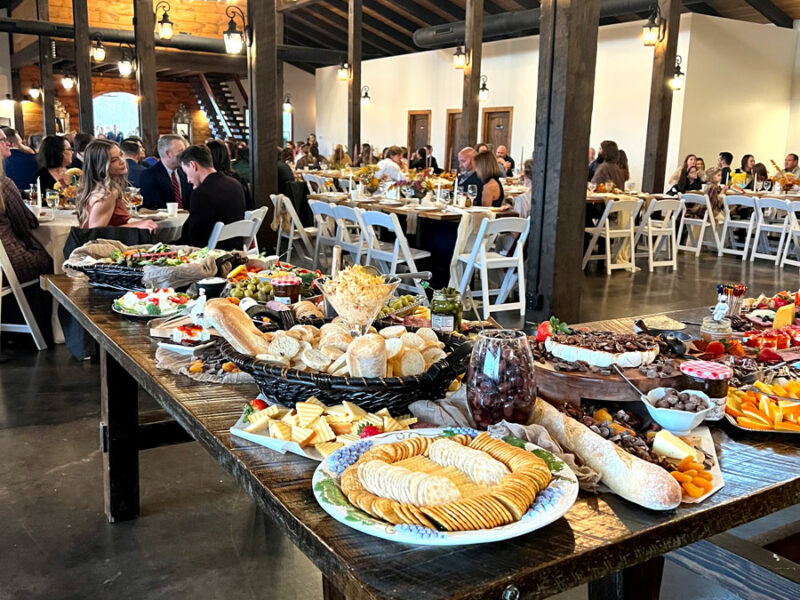 A large room filled with food catered for a corporate event.