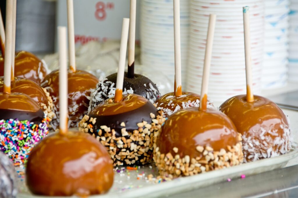 A tray of caramel apples perfect for fall party ideas.