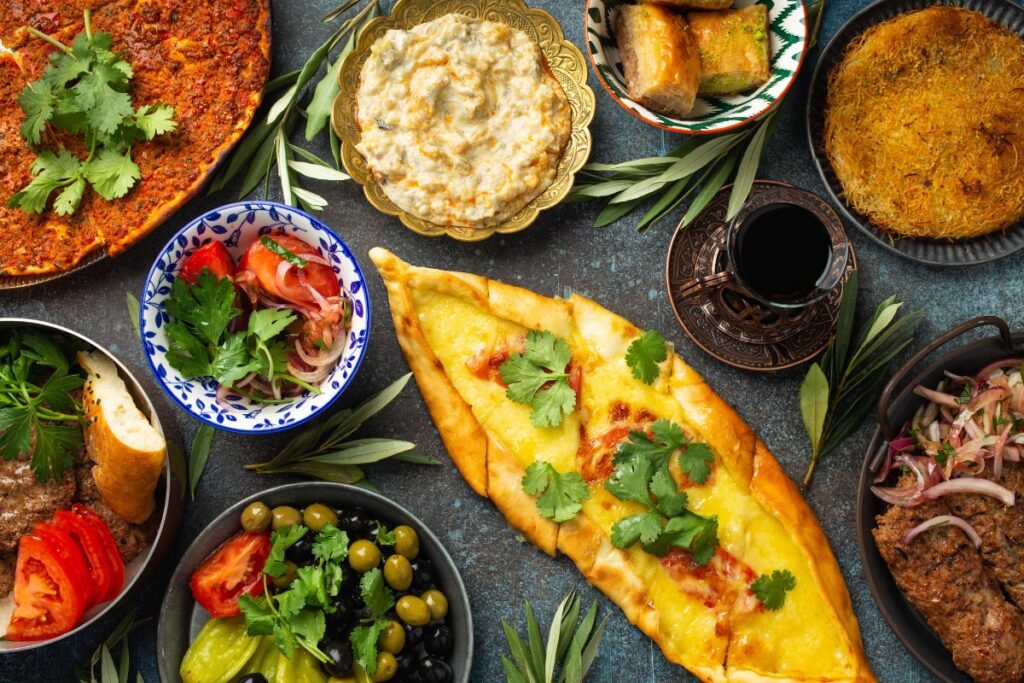 A variety of traditional Turkish dishes spread out on a table.