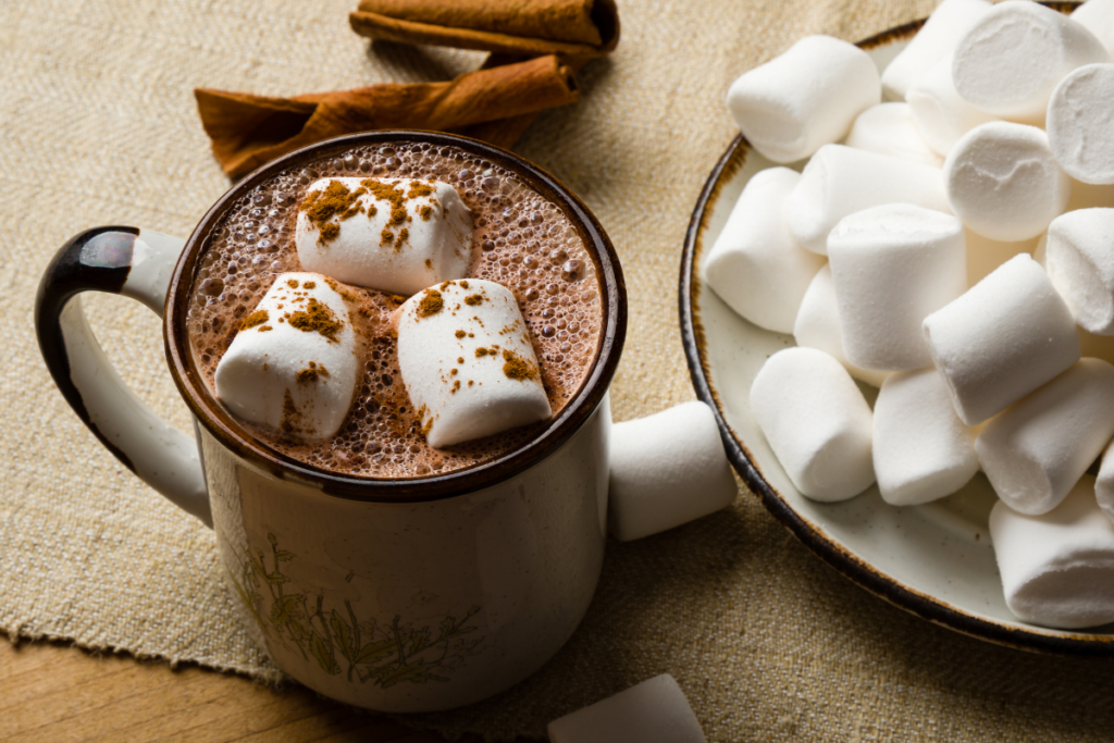 A cup of hot chocolate with marshmallows, perfect for a cozy hot cocoa party.