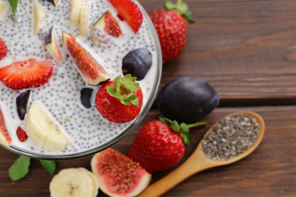 A bowl of vegan chia pudding with fruit and berries.