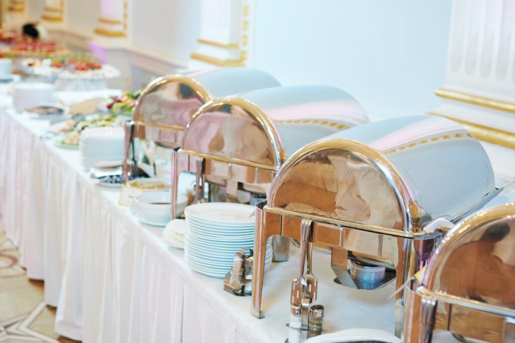 A catering buffet is lined up on a table.