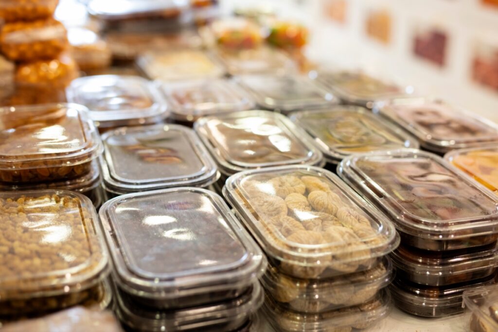 A variety of containers filled with catering food.