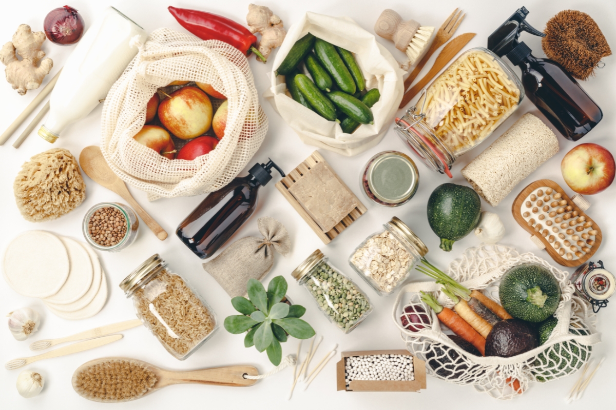 An eco-friendly assortment of food items are arranged on a white background.