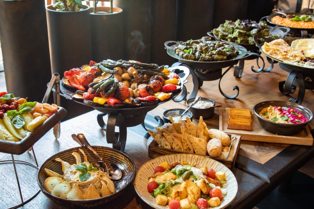 A buffet of food styling on a wooden table.